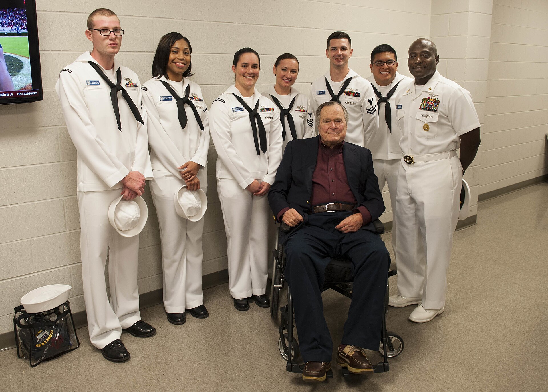 161112-N-SO730-304 (COLLEGE STATION, Texas) Former President George H.W. Bush poses for a portrait with Sailors assigned to USS George H.W. Bush (CVN 77) during a military appreciation football game at Texas A&M University. The game is part of a two-day namesake trip to Texas where Sailors engaged with the local community about the importance of the Navy in defense and prosperity. (U.S. Navy photo by Seaman Joe Boggio / Released) Unit: Navy Media Content Services DVIDS Tags: Habitat for Humanity; College Station; Texas; Sailors of the Year; NMCS; DVIDS Bulk Import; CMC Huben Phillips